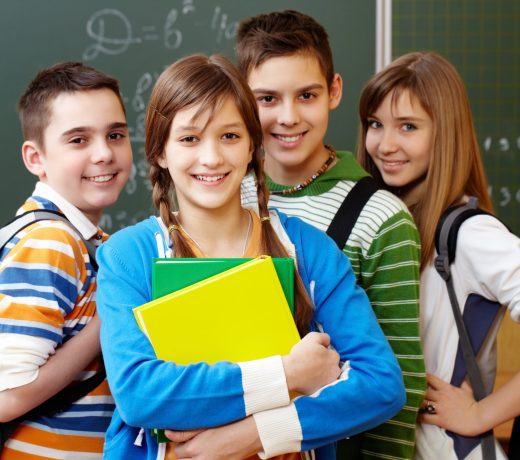 Smart students Portrait of happy teens looking at camera with smiles